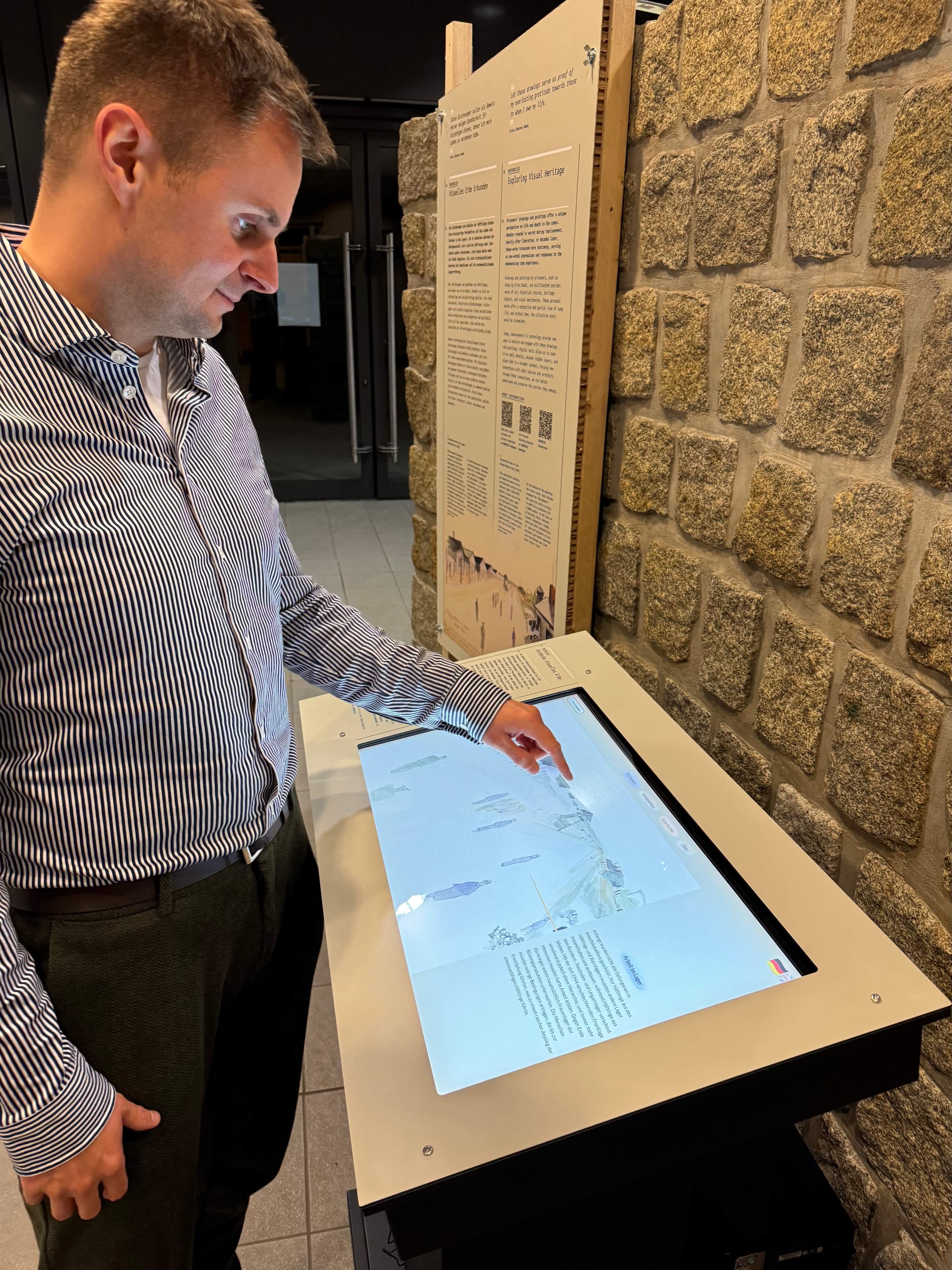 The interactive prisoner art explorer allows you to inspect details in a watercolor painting of a perspective view of the Bergen-Belsen Concentration Camp and offers a guided storytelling tour through the various details of the painting. This is currently exhibited at the memorial of Bergen-Belsen, Germany. 2024